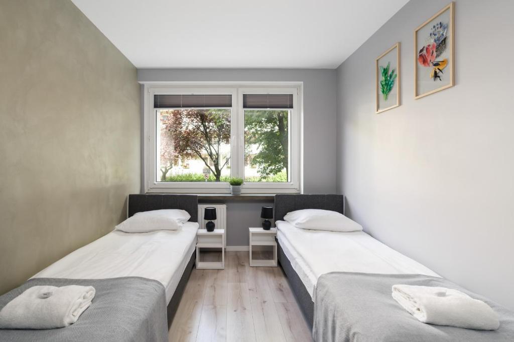 Posteľ alebo postele v izbe v ubytovaní Family Apartment Poznań Rataje by Noclegi Renters