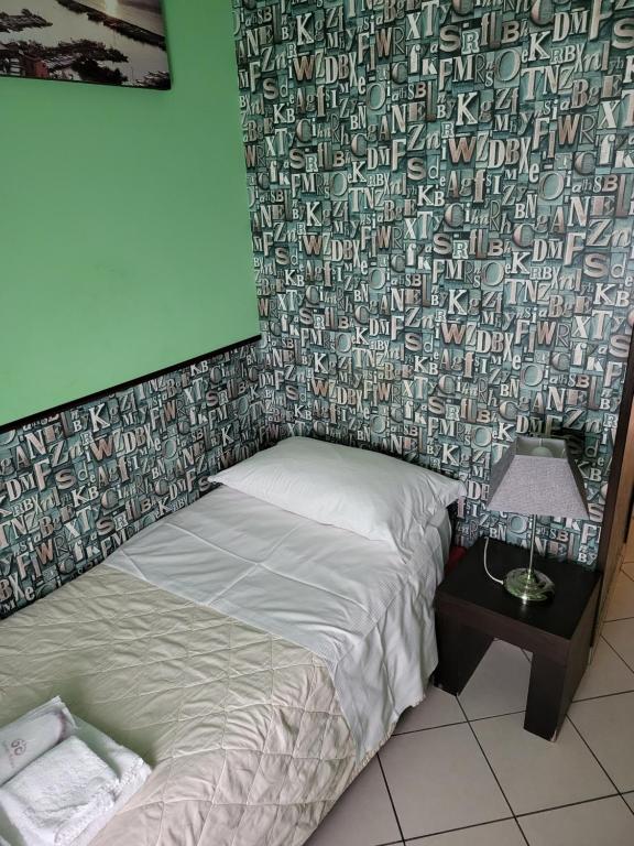 Postel nebo postele na pokoji v ubytování Sorrento Relais