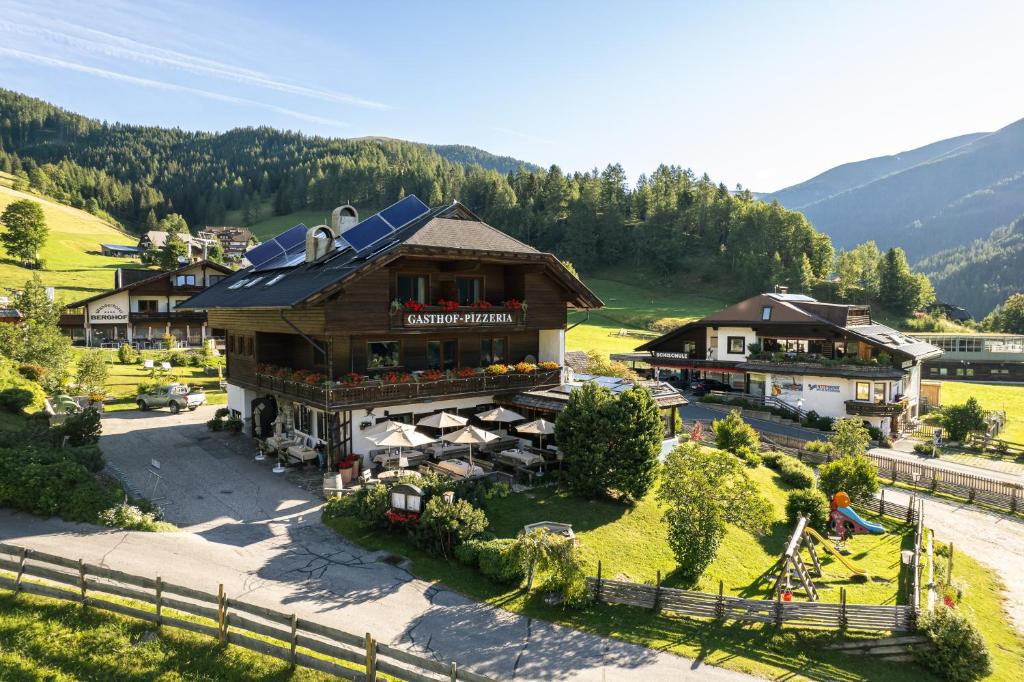 an aerial view of a building in the mountains at Gasthof-Appartements Sportalm in Bad Kleinkirchheim