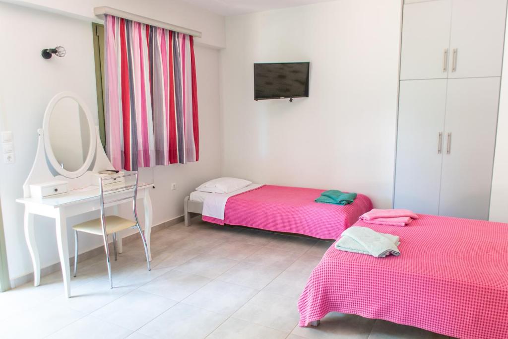 Postel nebo postele na pokoji v ubytování Holiday Rooms