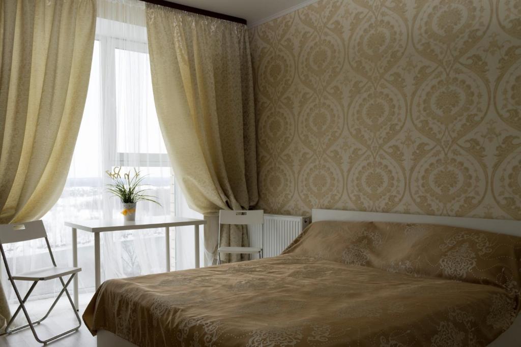 En eller flere senge i et værelse på Mini Hotel Evropa