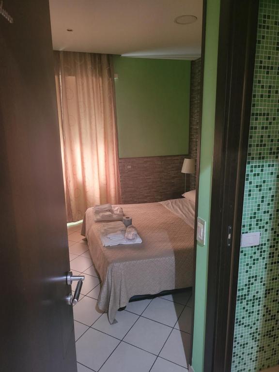 Postel nebo postele na pokoji v ubytování Sorrento Relais