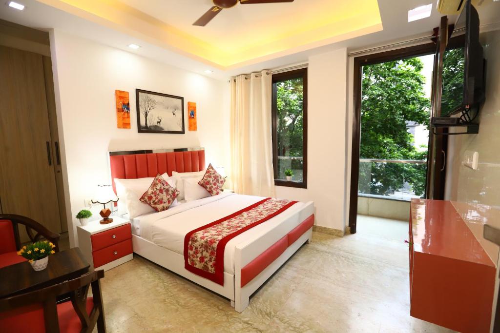 a bedroom with a bed and a large window at Hotel Nature View Green Park Metro Couple Friendly New Delhi in New Delhi