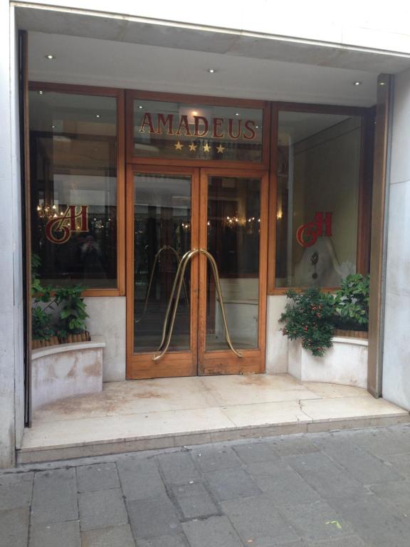 an entrance to an amadeus store with a wooden door at Hotel Amadeus in Venice
