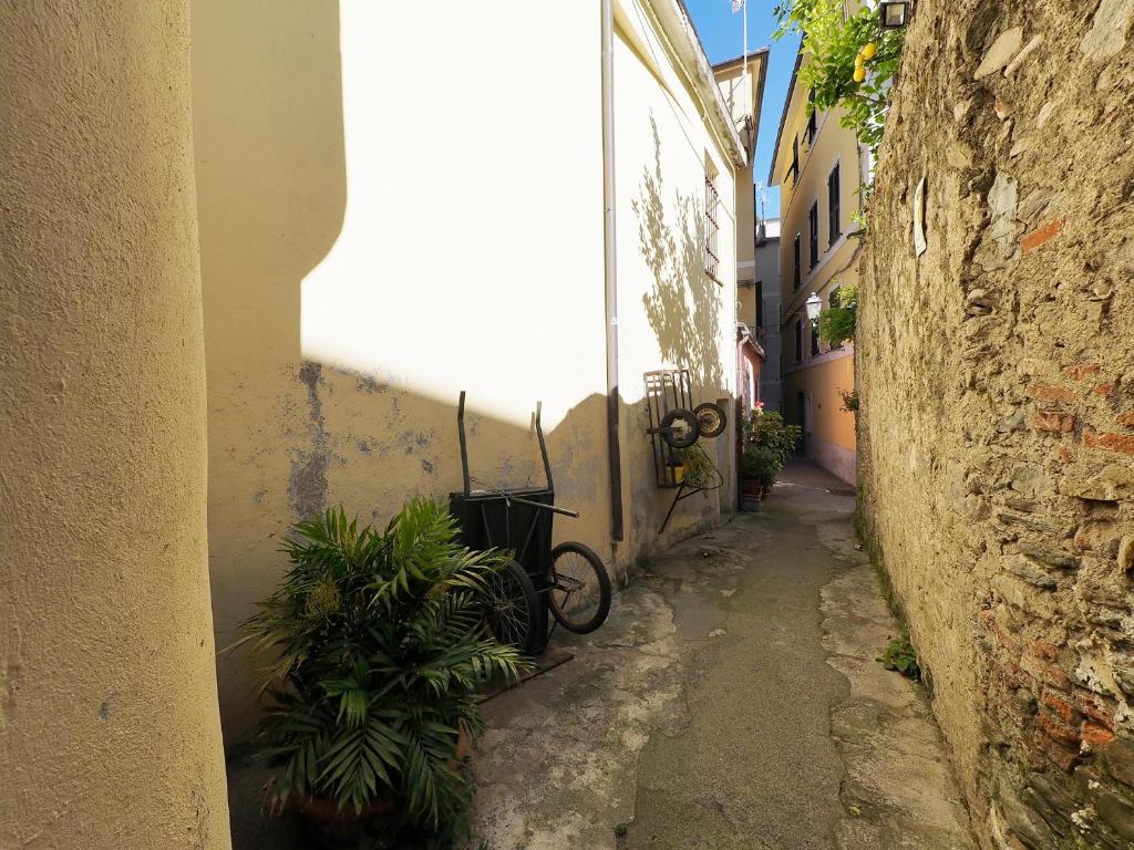 an alley with a bike parked next to a building at Hotel Margherita in Monterosso al Mare