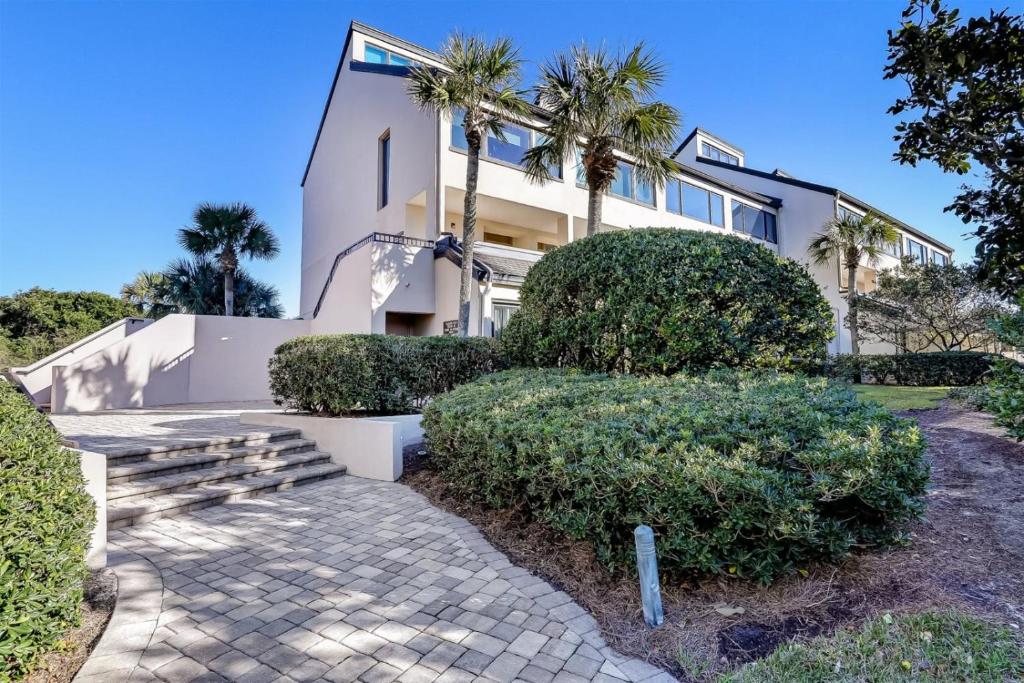 a house with palm trees in front of it at 1029 Captains Court in Fernandina Beach