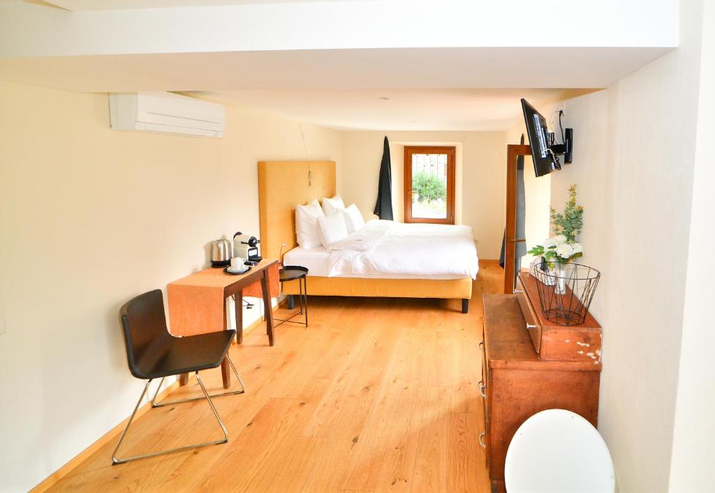 Postel nebo postele na pokoji v ubytování Boato Bistrot & Bed