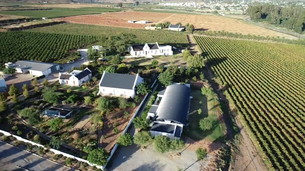 an aerial view of a farm with a silo at Sempurna Estate in McGregor