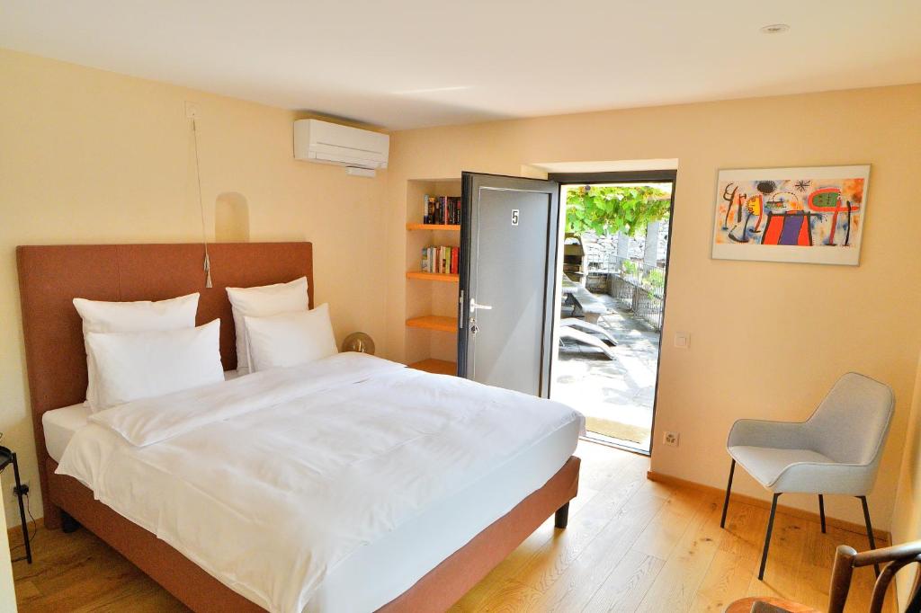 Postel nebo postele na pokoji v ubytování Boato Bistrot & Bed