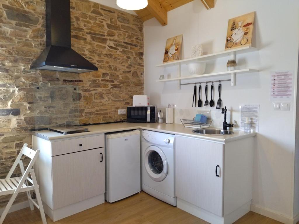 Kuchyň nebo kuchyňský kout v ubytování Apartamentos A Palleira