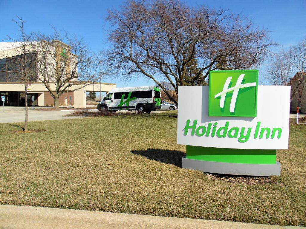 a sign for a holiday inn in front of a building at Holiday Inn - Bloomington - Normal by IHG in Normal