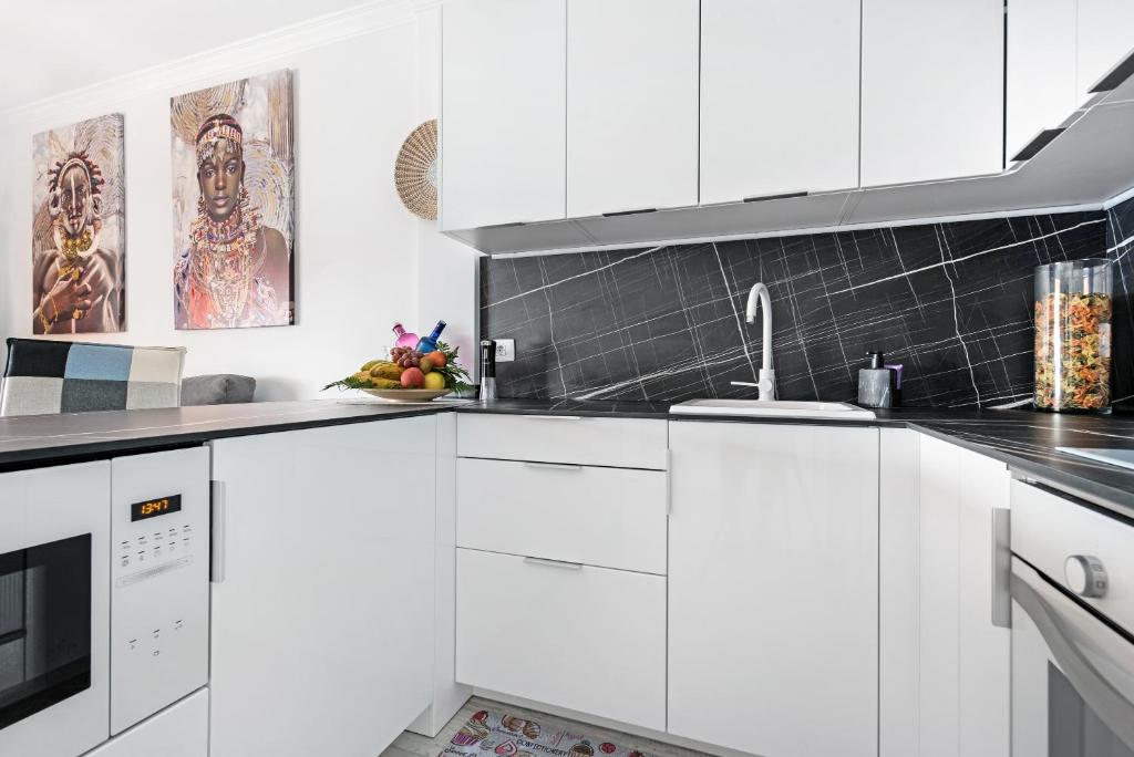 Kuchyň nebo kuchyňský kout v ubytování Apartamento junto al Mar
