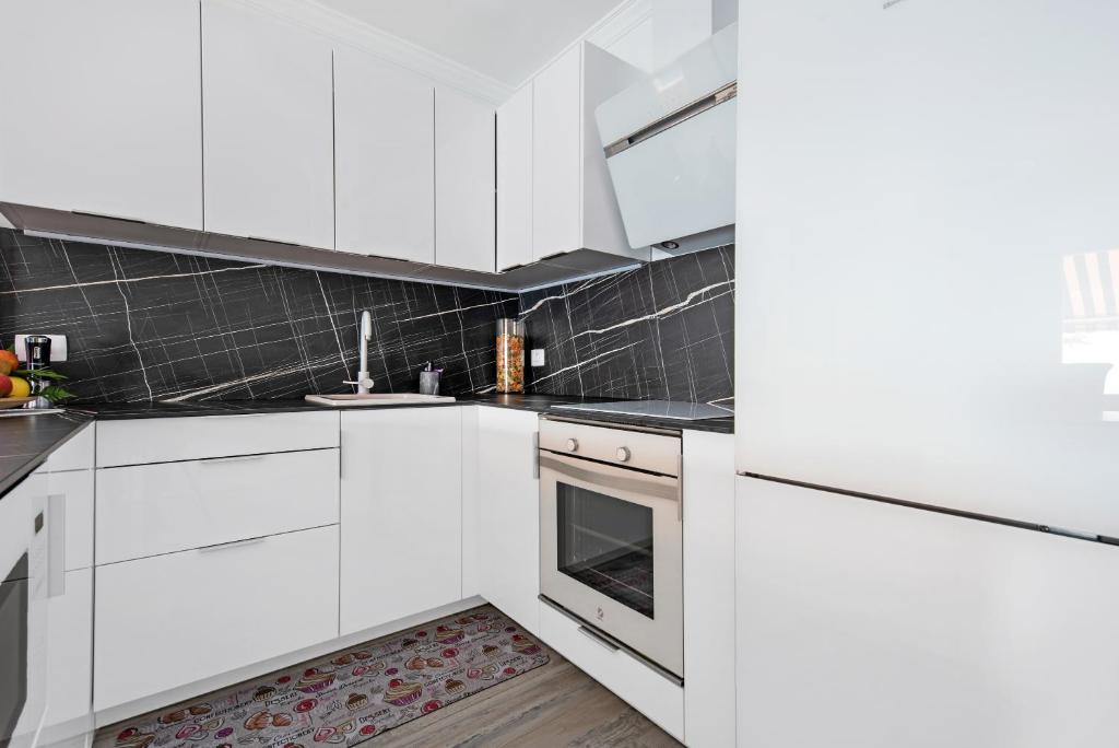 Kuchyň nebo kuchyňský kout v ubytování Apartamento junto al Mar