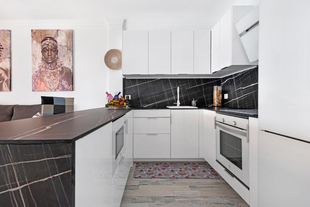 Kuchyň nebo kuchyňský kout v ubytování Apartamento junto al Mar