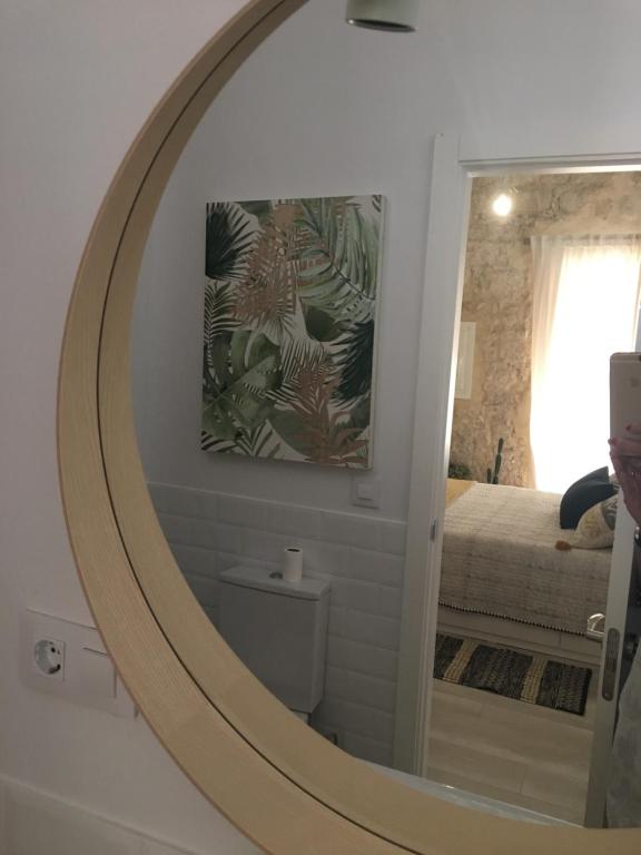 Łóżko lub łóżka w pokoju w obiekcie Loft Xerez Centro