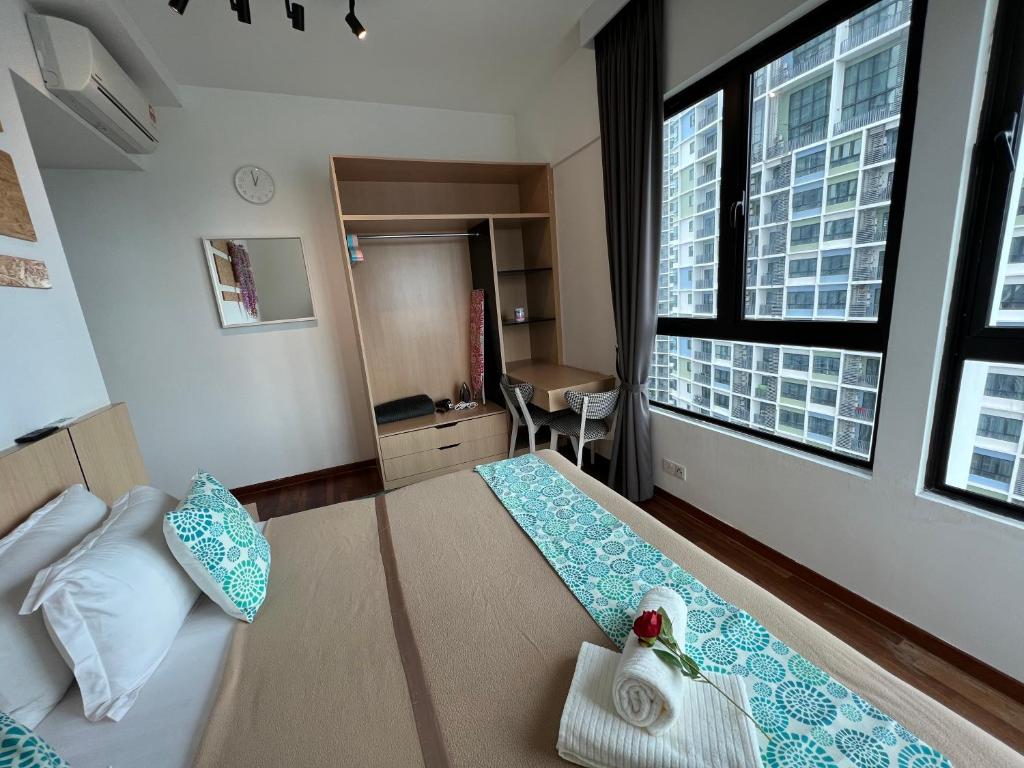 Postel nebo postele na pokoji v ubytování D'Gunduls Homestay Family Suite 2R 2B by DGH I-CITY