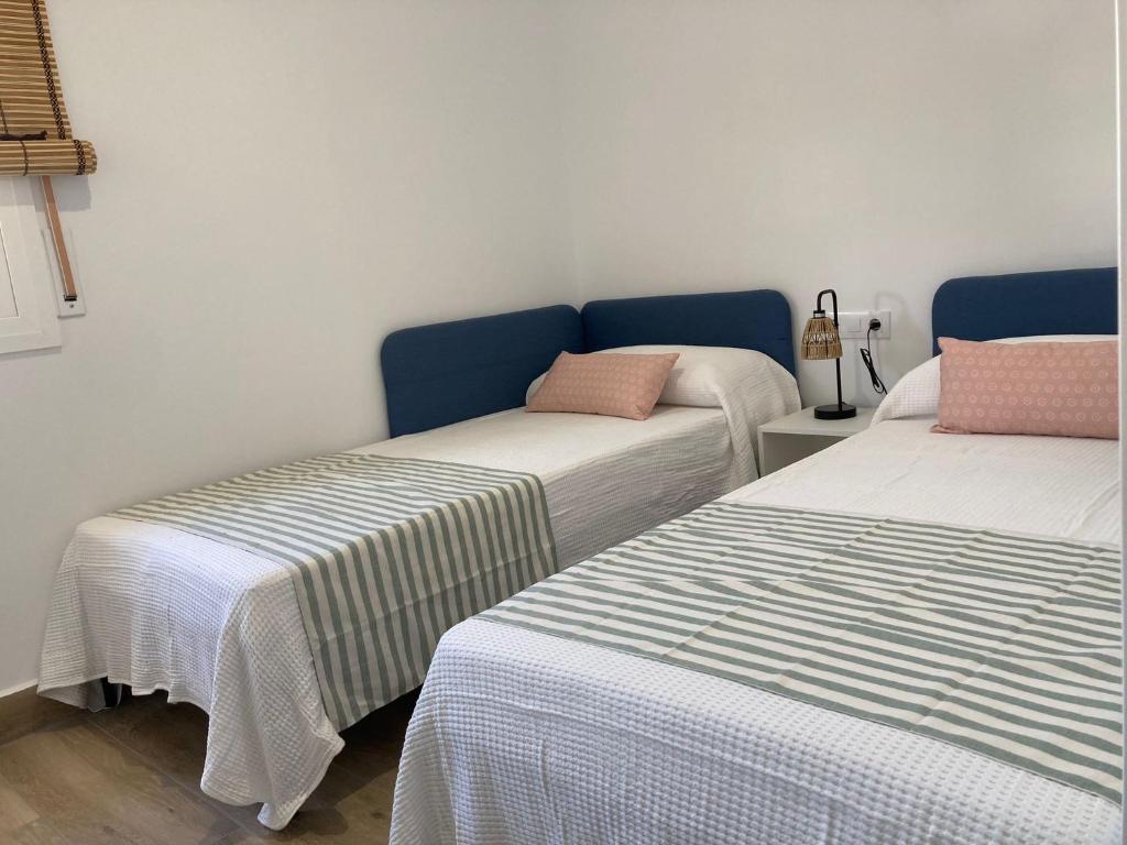 Posteľ alebo postele v izbe v ubytovaní Zona5 Apartamentos Turísticos