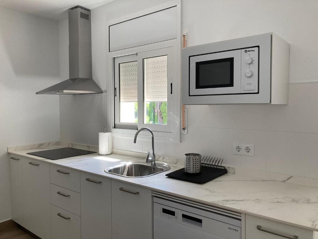 Kuchyňa alebo kuchynka v ubytovaní Zona5 Apartamentos Turísticos