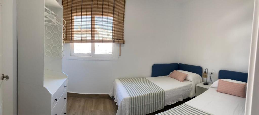 Posteľ alebo postele v izbe v ubytovaní Zona5 Apartamentos Turísticos