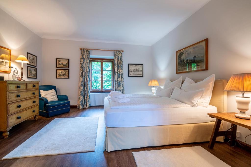 Postel nebo postele na pokoji v ubytování Gästehaus Golf Club Gut Murstätten