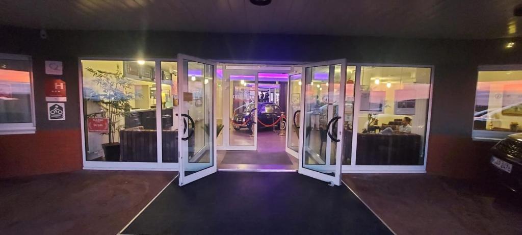 a front door of a room with glass doors at Hotel de l&#39;Europe in Dieppe