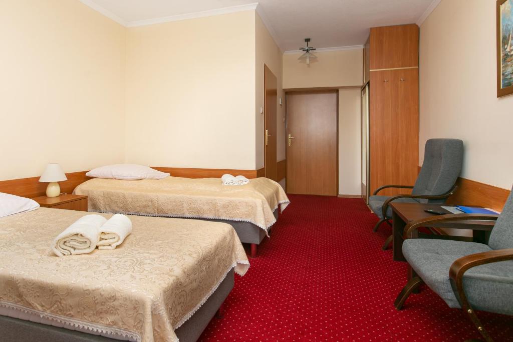Postel nebo postele na pokoji v ubytování Korona Żywca