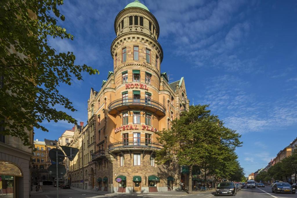 a tall building with a tower on top of it at Crystal Plaza Hotel in Stockholm