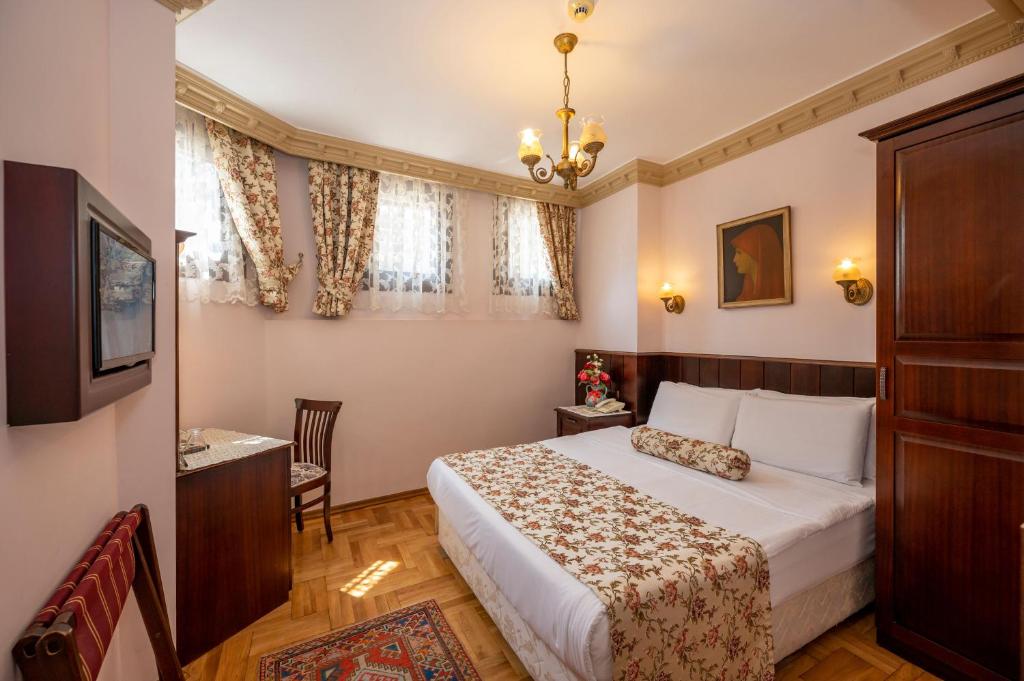Postel nebo postele na pokoji v ubytování Osmanhan Hotel