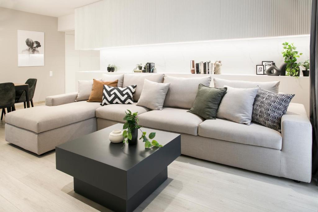 a living room with a couch and a coffee table at Ultra Chic Modern 4 Bedrooms Apartment in Athens in Athens
