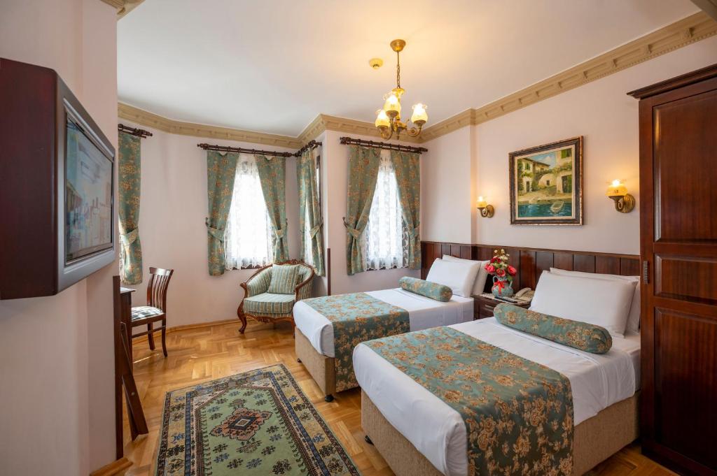 Postel nebo postele na pokoji v ubytování Osmanhan Hotel