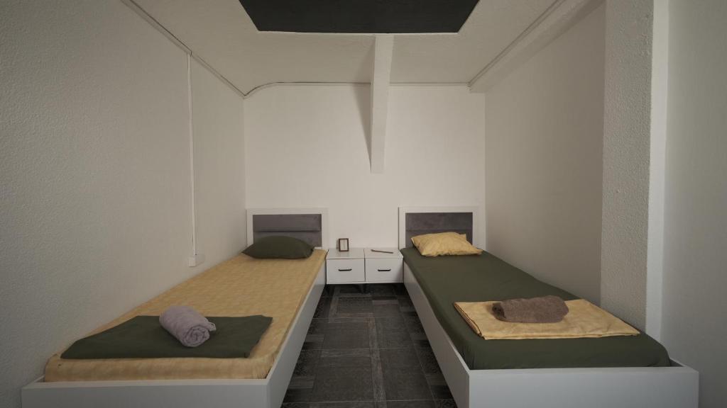 Postel nebo postele na pokoji v ubytování Hostel Dera