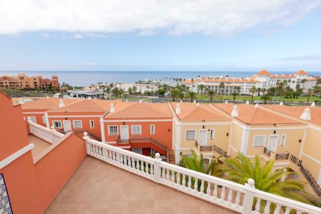 a balcony of a house with a view of the ocean at Apartamento Sara en el Veril del Duque - Sara Vacation in Adeje
