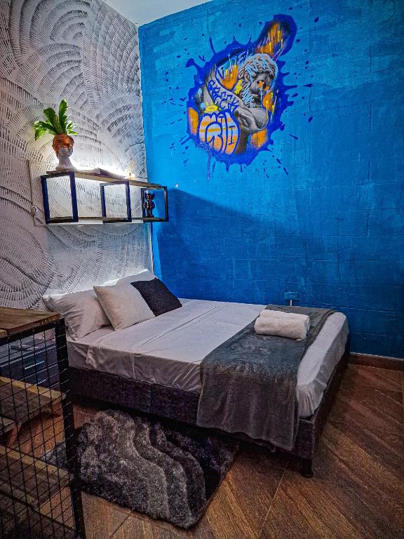 Postel nebo postele na pokoji v ubytování Urban Hostal Bar