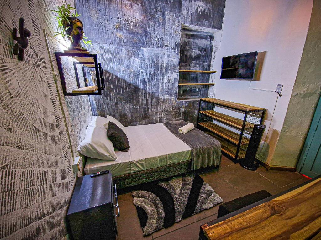 Postel nebo postele na pokoji v ubytování Urban Hostal Bar