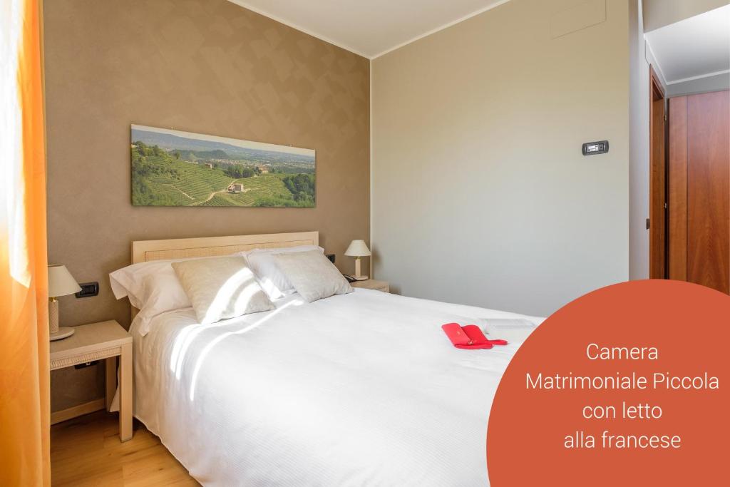 Postel nebo postele na pokoji v ubytování Wine Hotel San Giacomo Activity & Wellness