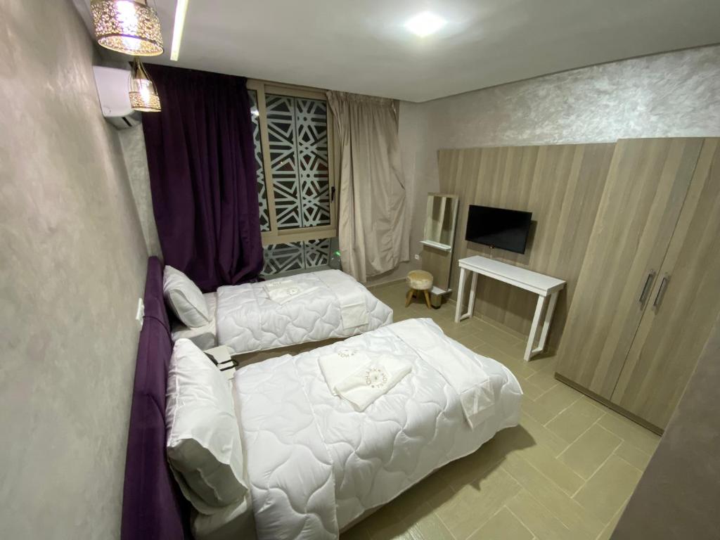 Postel nebo postele na pokoji v ubytování Hôtel Chark