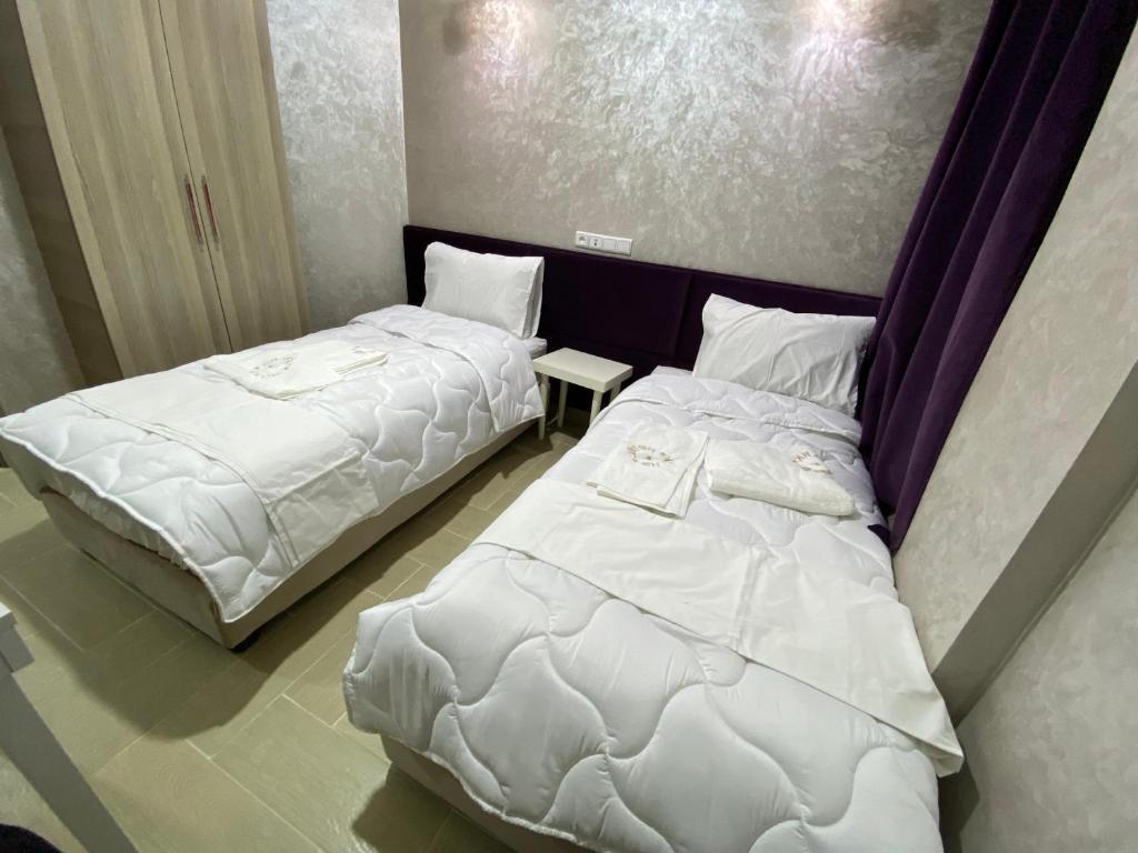 Postel nebo postele na pokoji v ubytování Hôtel Chark