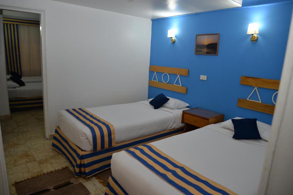 Postel nebo postele na pokoji v ubytování Marhaba Palace Hotel