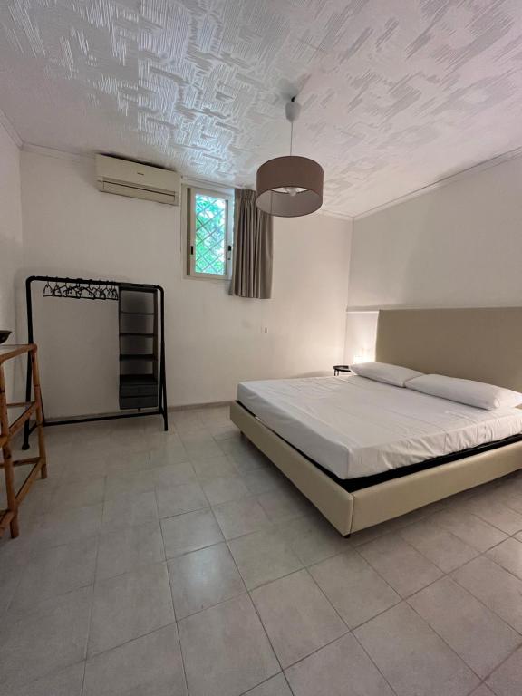 Ένα ή περισσότερα κρεβάτια σε δωμάτιο στο Harin House Casa vacanze