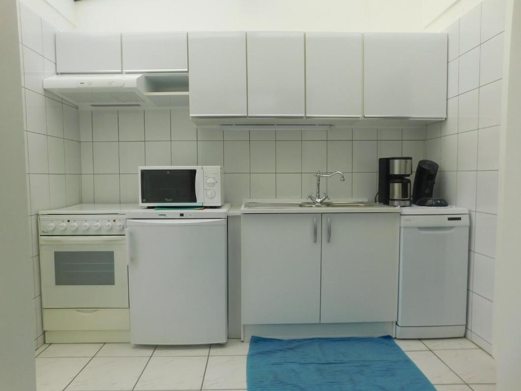 Kuchyň nebo kuchyňský kout v ubytování Vakantiewoning Louis