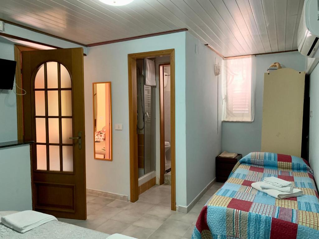 Postel nebo postele na pokoji v ubytování La Casa di Gabry 2