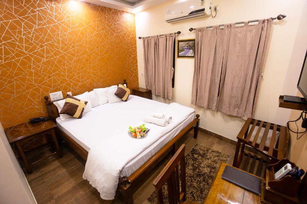 Postel nebo postele na pokoji v ubytování Hotel Cecil