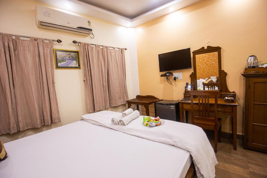 Postel nebo postele na pokoji v ubytování Hotel Cecil