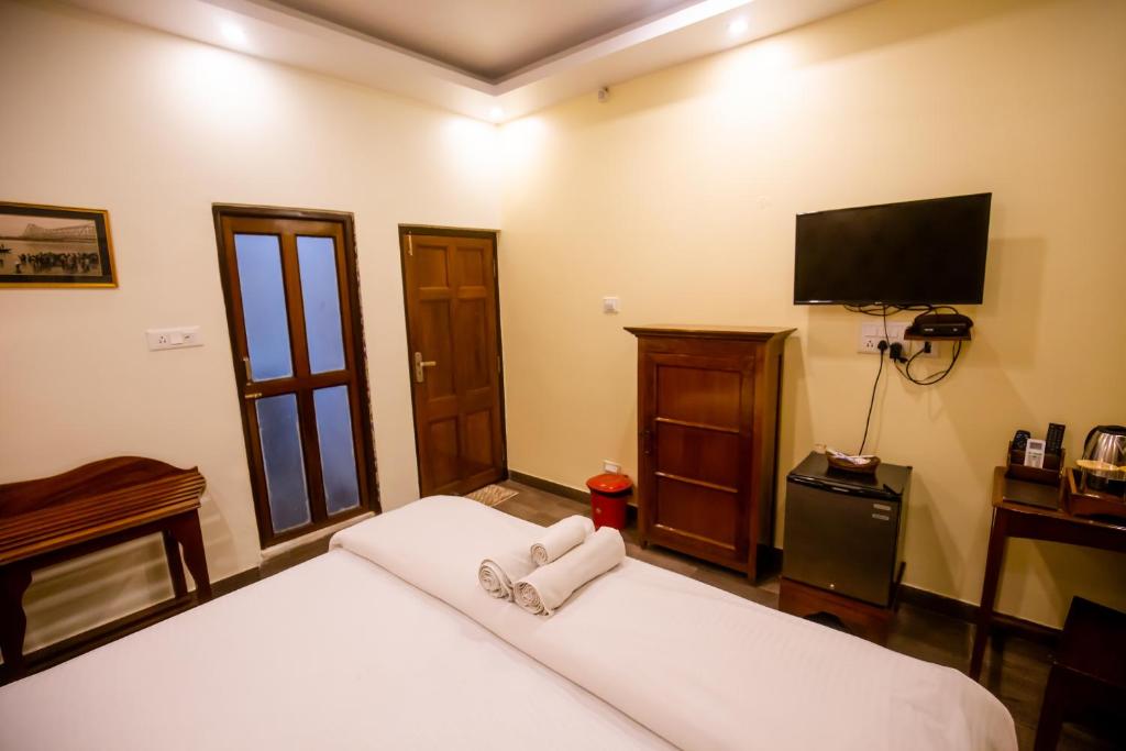 Postel nebo postele na pokoji v ubytování Hotel Cecil