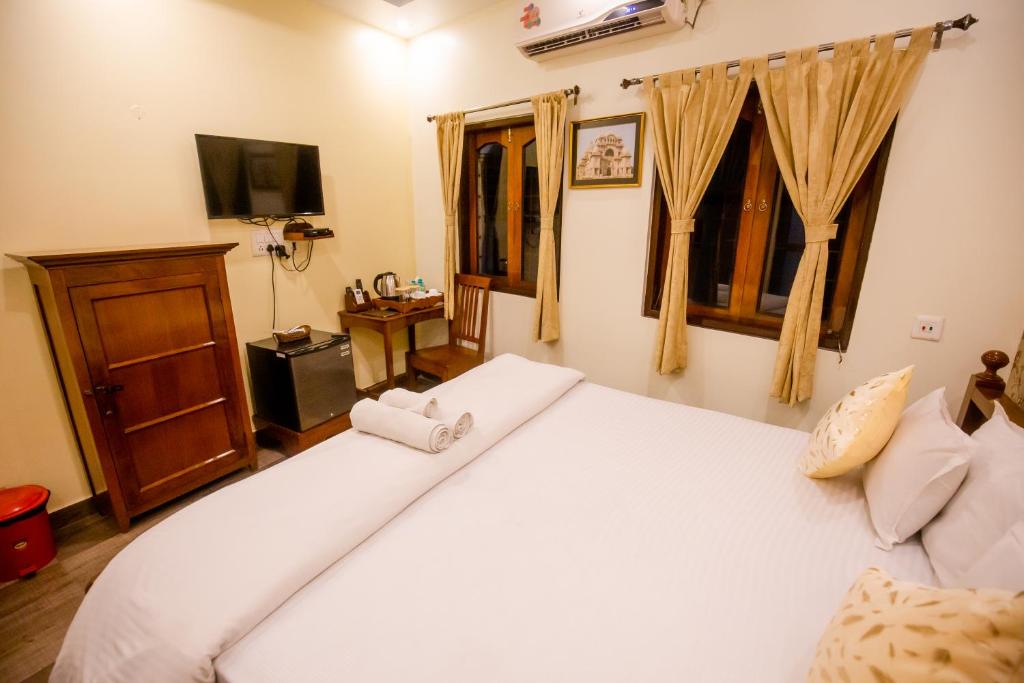 Postel nebo postele na pokoji v ubytování Hotel Cecil
