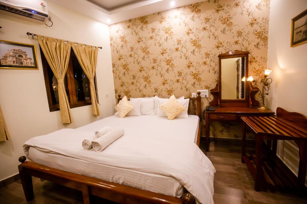 Postel nebo postele na pokoji v ubytování Hotel Cecil