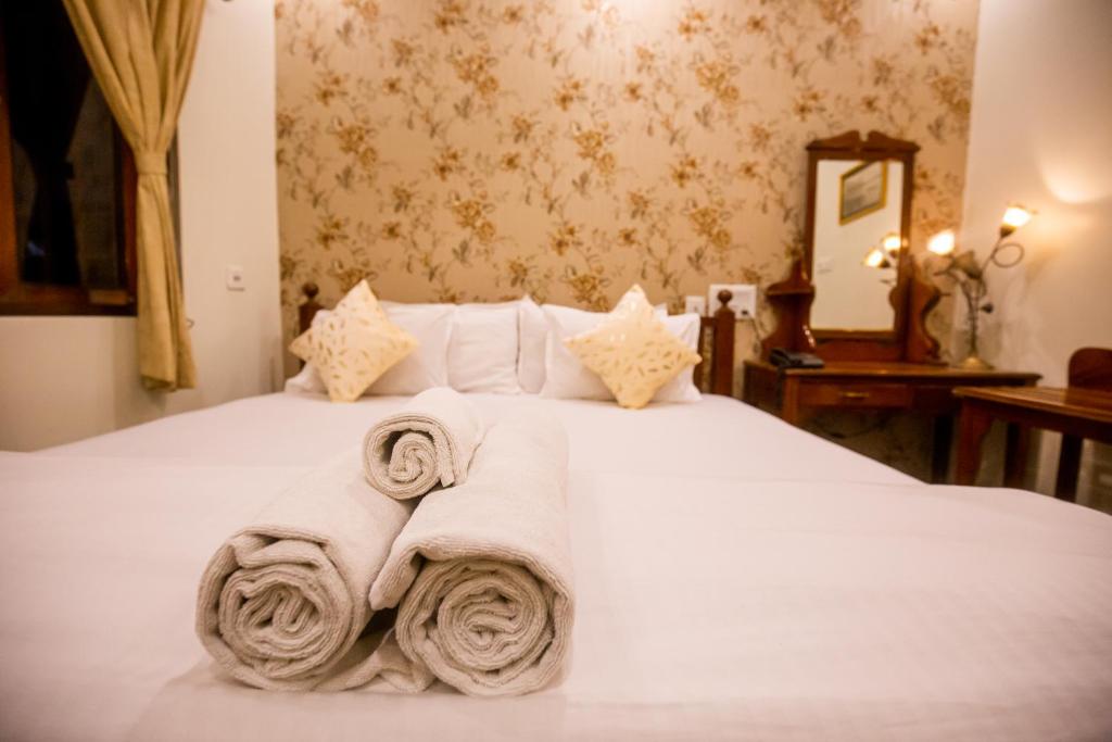 Postel nebo postele na pokoji v ubytování Hotel Cecil