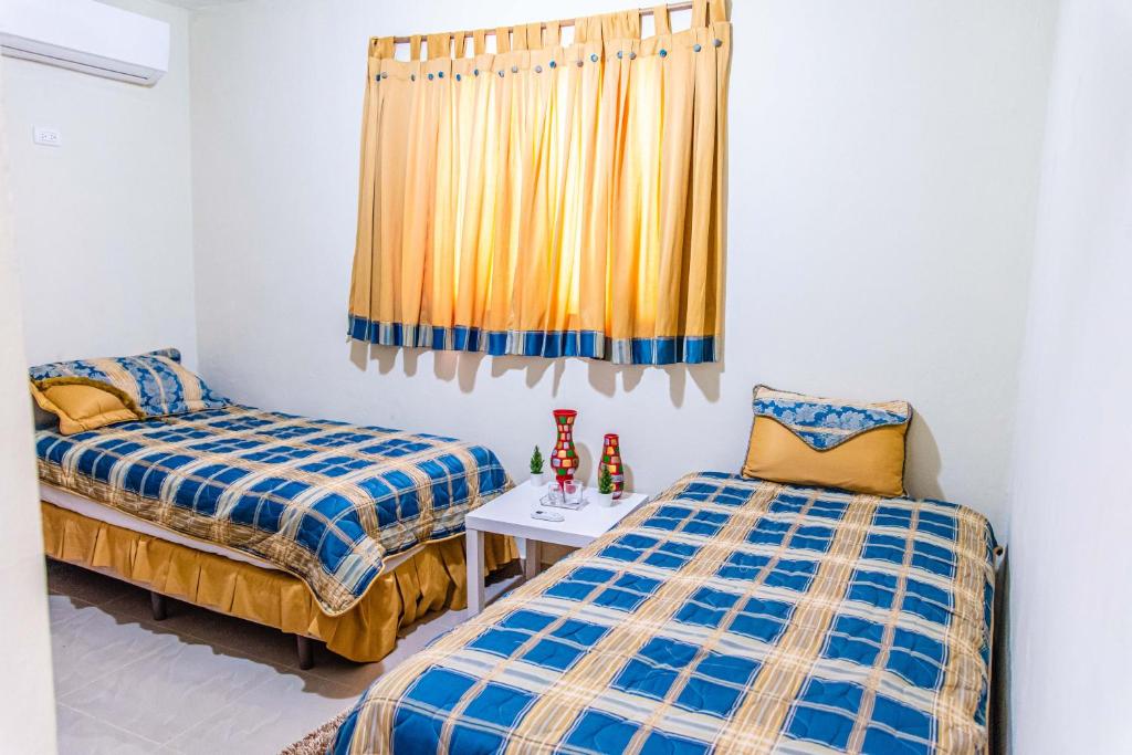 Postel nebo postele na pokoji v ubytování El Paraiso, Gurabo