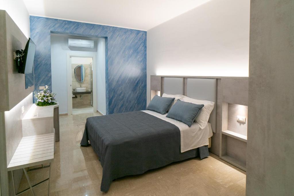 Postel nebo postele na pokoji v ubytování Le margherite B&B