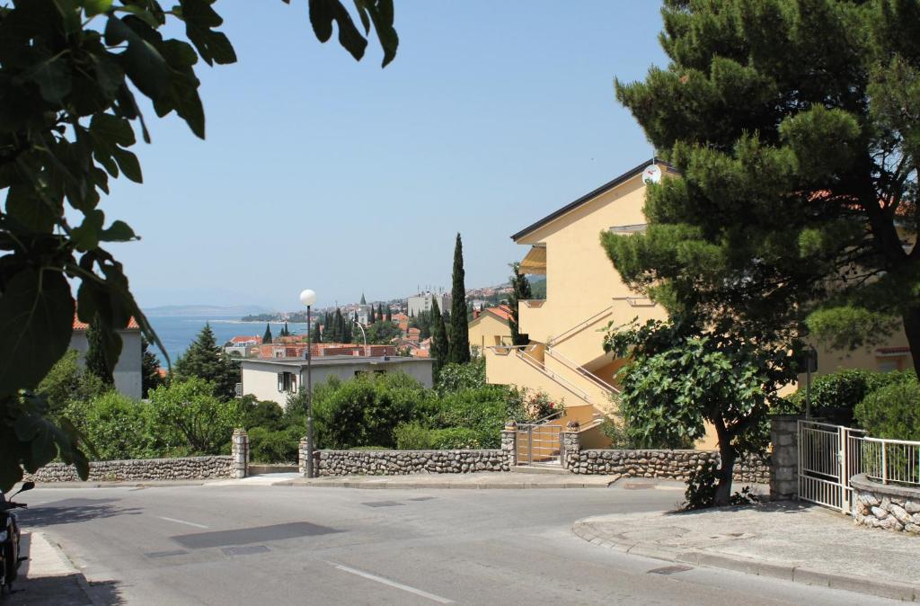 a street in a town with houses and trees at Apartments with a parking space Selce, Crikvenica - 2361 in Selce
